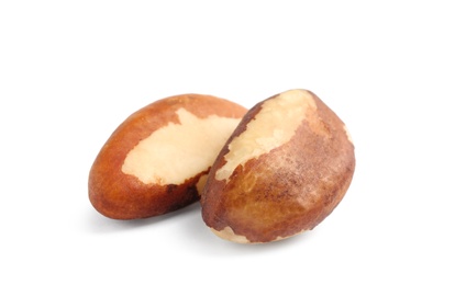 Photo of Tasty brasil nuts on white background, closeup