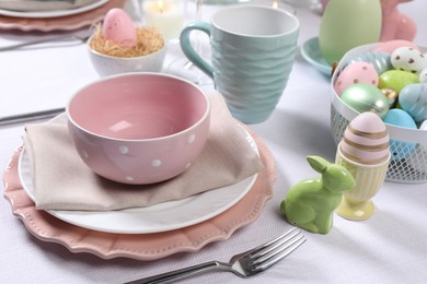 Festive table setting with painted eggs. Easter celebration