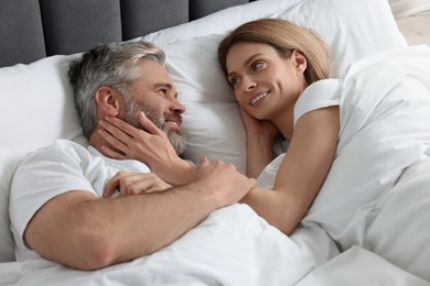 Photo of Lovely mature couple in bed at home