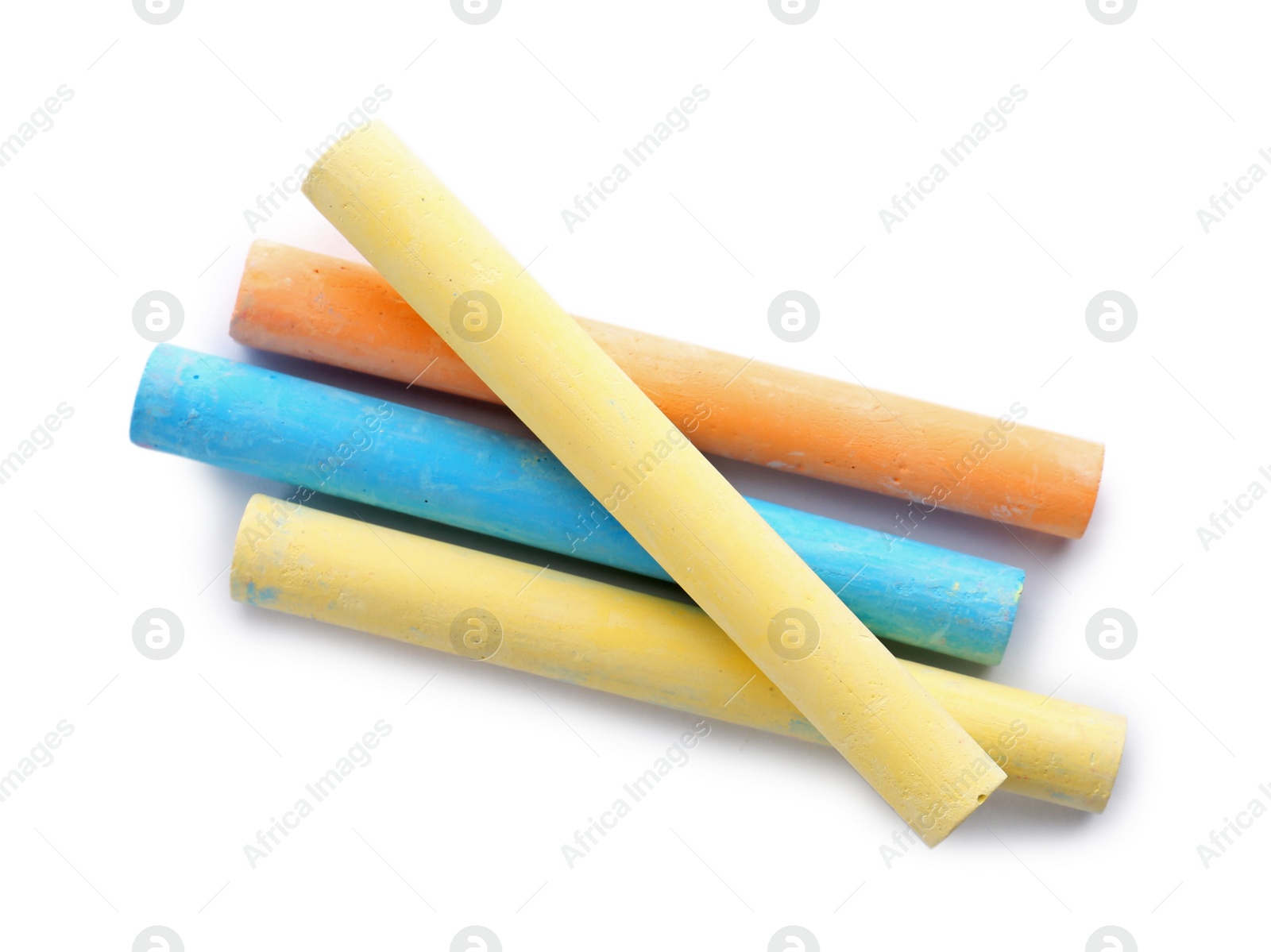 Photo of Color pieces of chalk on white background