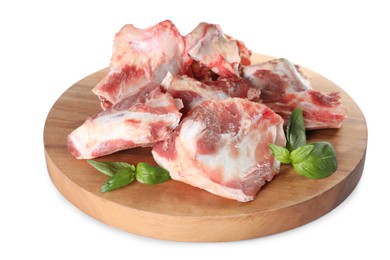 Raw meaty bones and basil on white background