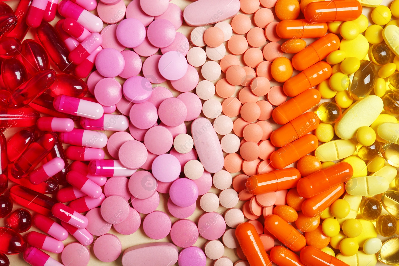 Photo of Different colorful pills as background, top view