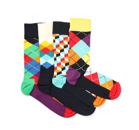 Photo of Colorful socks on white background, top view