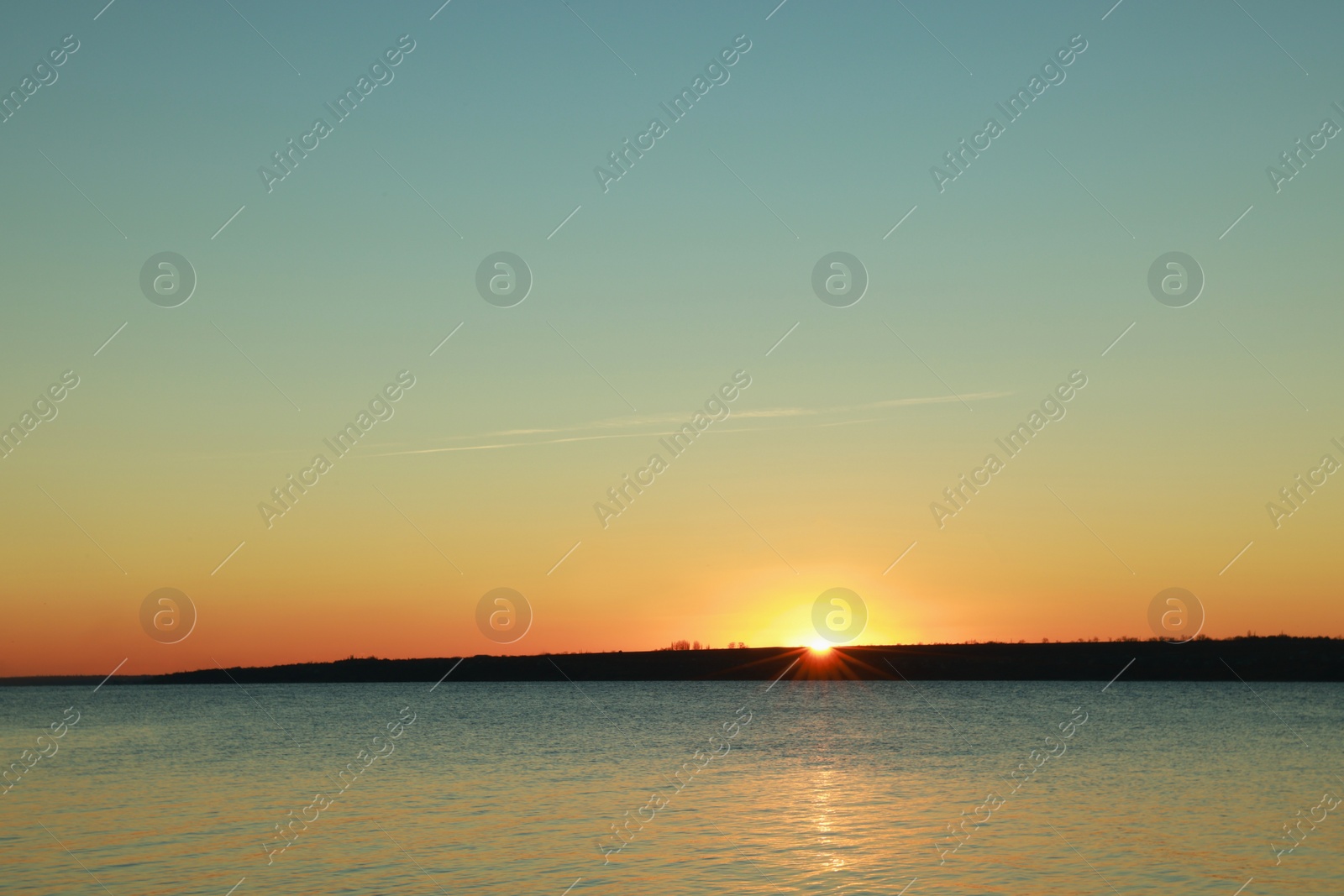 Photo of Picturesque view of beautiful sunset over calm river