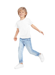 Photo of Happy little boy in casual outfit on light grey background