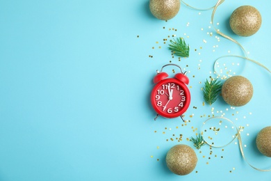 Flat lay composition with alarm clock and decorations on color background. Christmas countdown