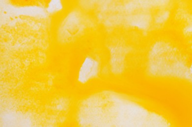 Photo of Abstract yellow watercolor painting as background, top view