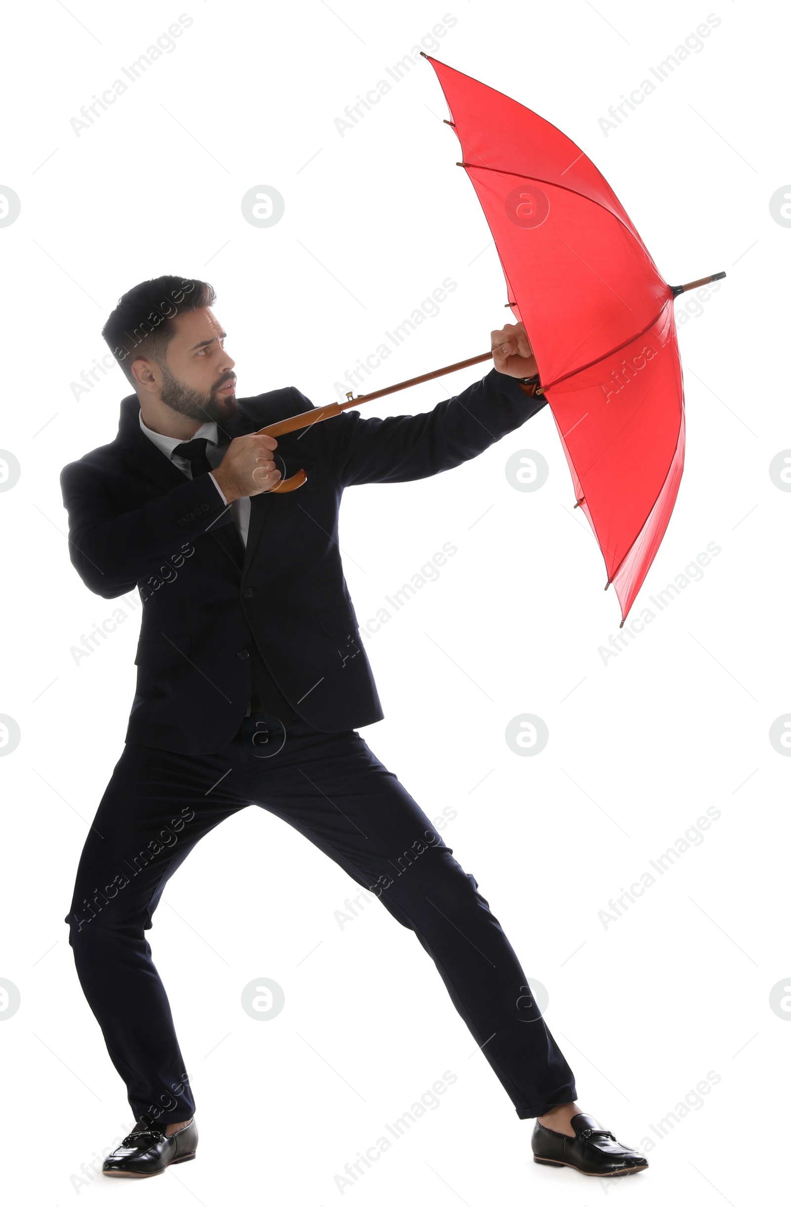 Photo of Businessman with red umbrella on white background