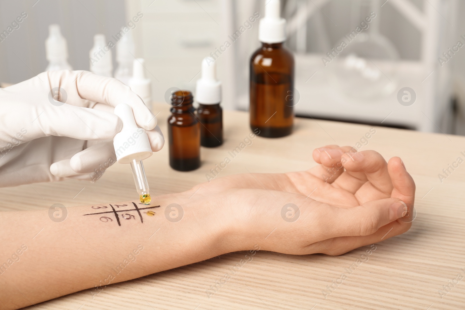 Photo of Doctor making allergy test at table, closeup