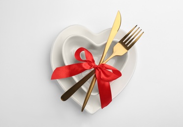 Beautiful table setting for Valentine's Day dinner on white background, top view