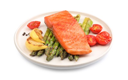 Photo of Tasty grilled salmon with asparagus, tomatoes, spices and lemon isolated on white