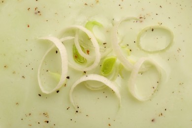 Tasty leek soup as background, top view