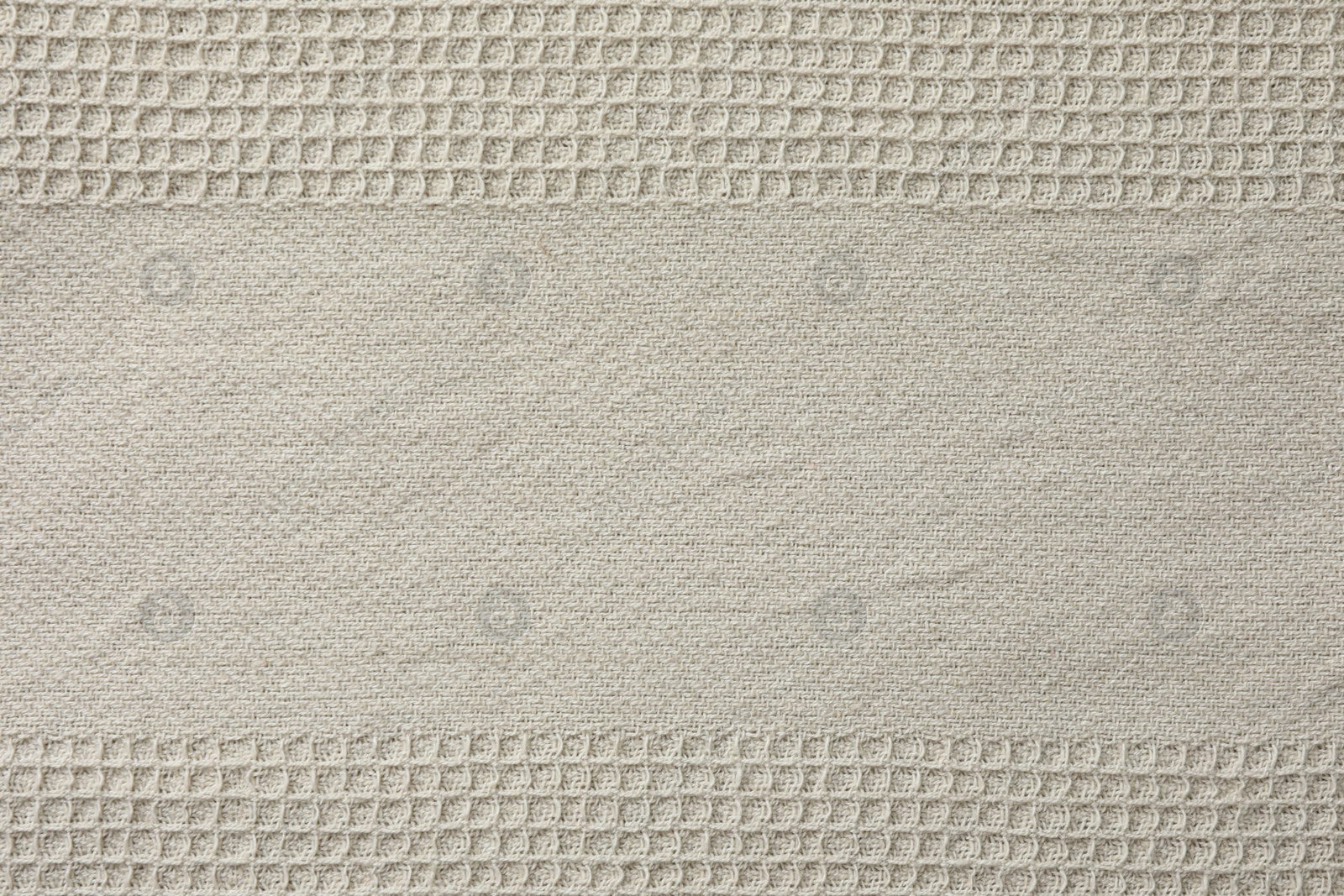 Photo of Texture of beige knitted fabric as background, top view
