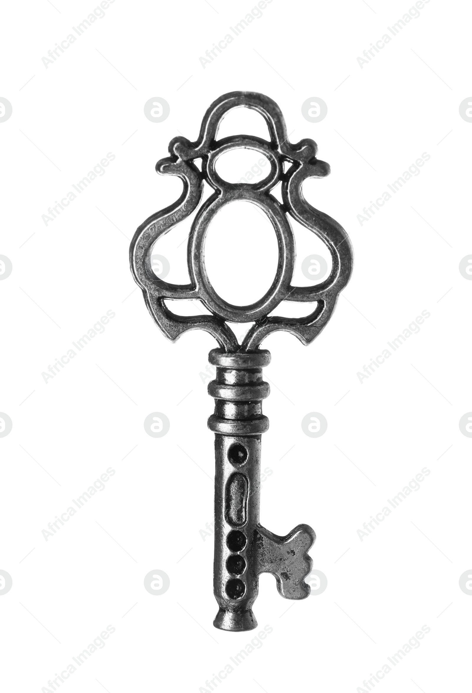 Photo of Steel vintage ornate key on white background