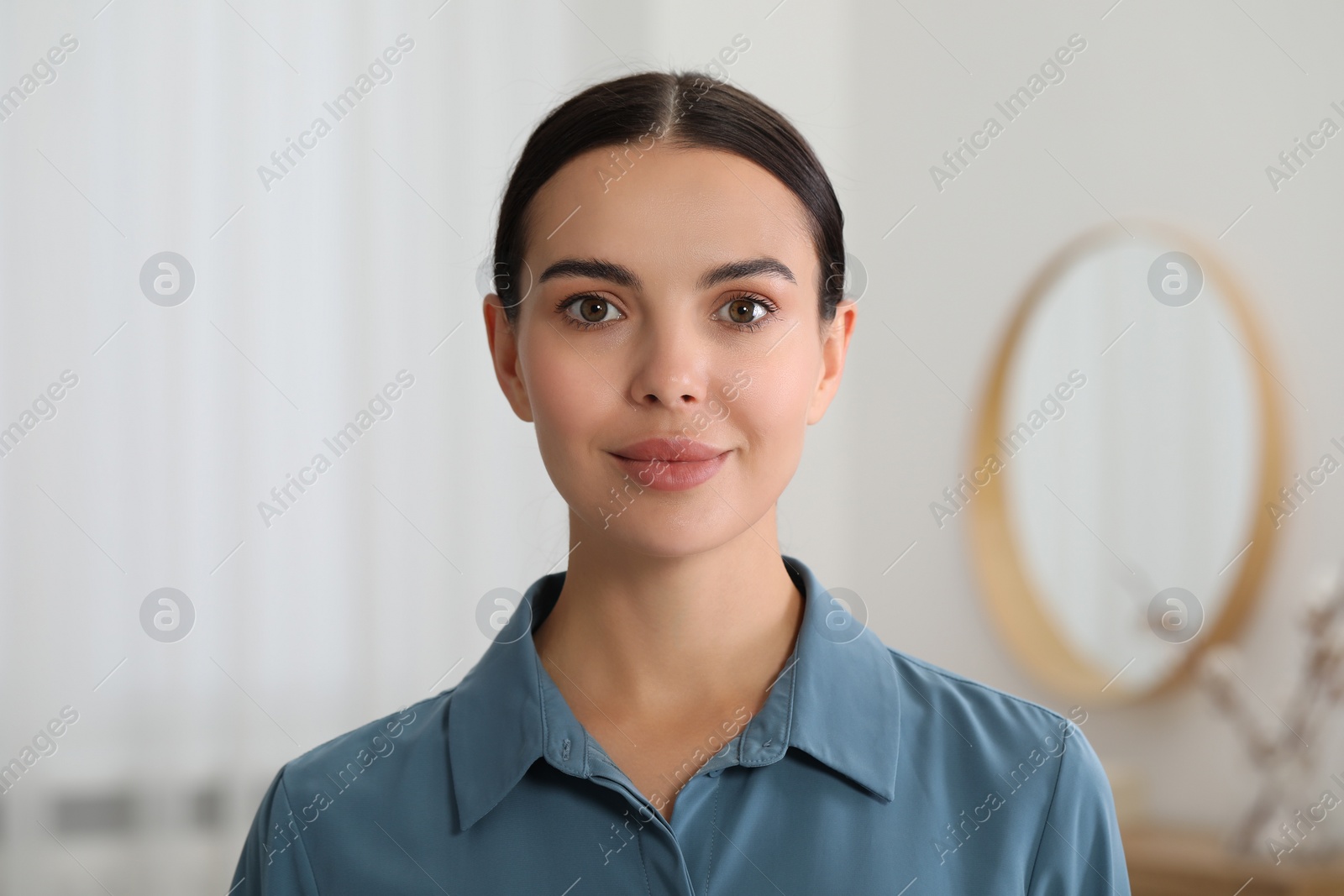 Photo of Portrait of beautiful young woman on blurred background