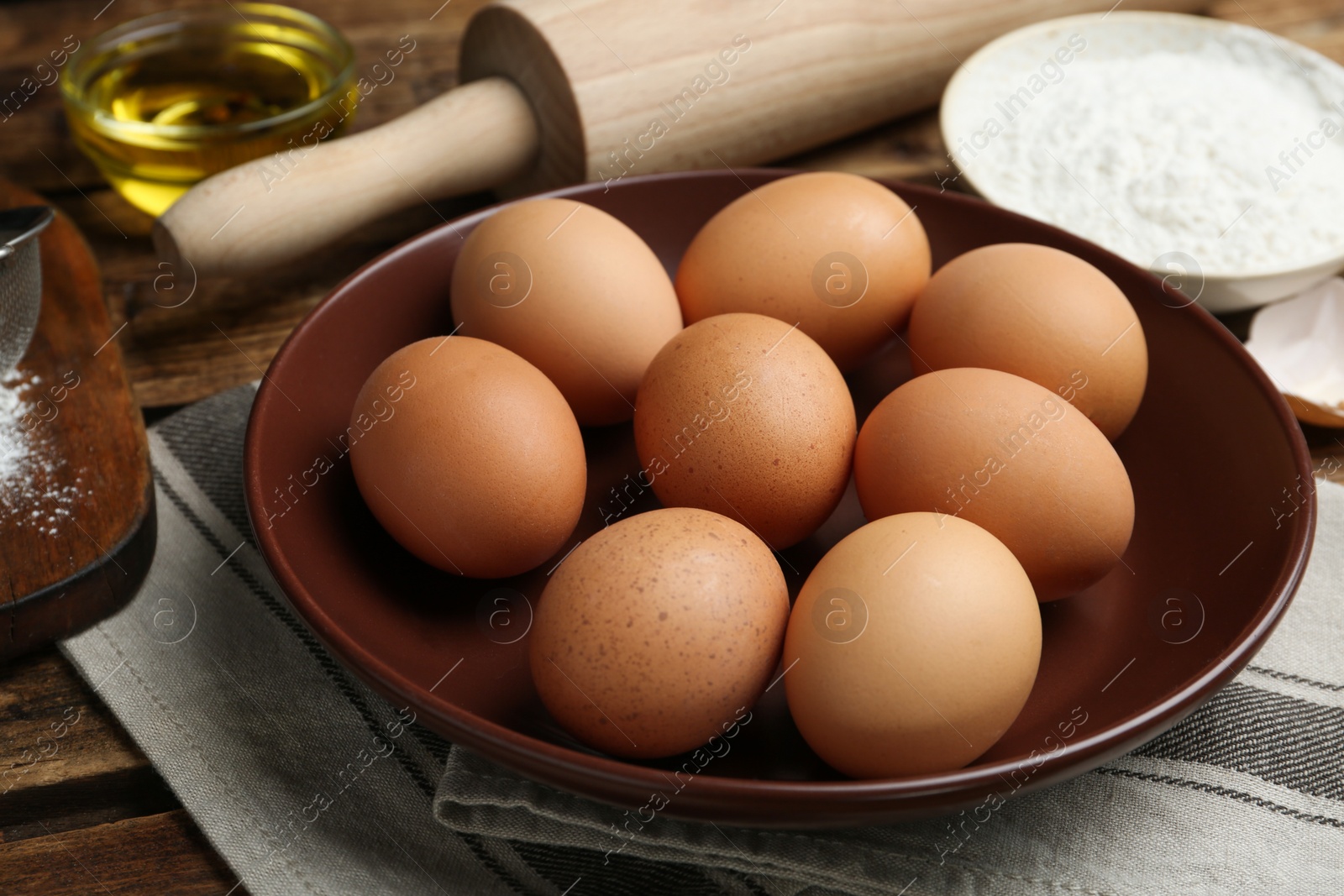 Photo of Fresh brown chicken eggs on wooden table