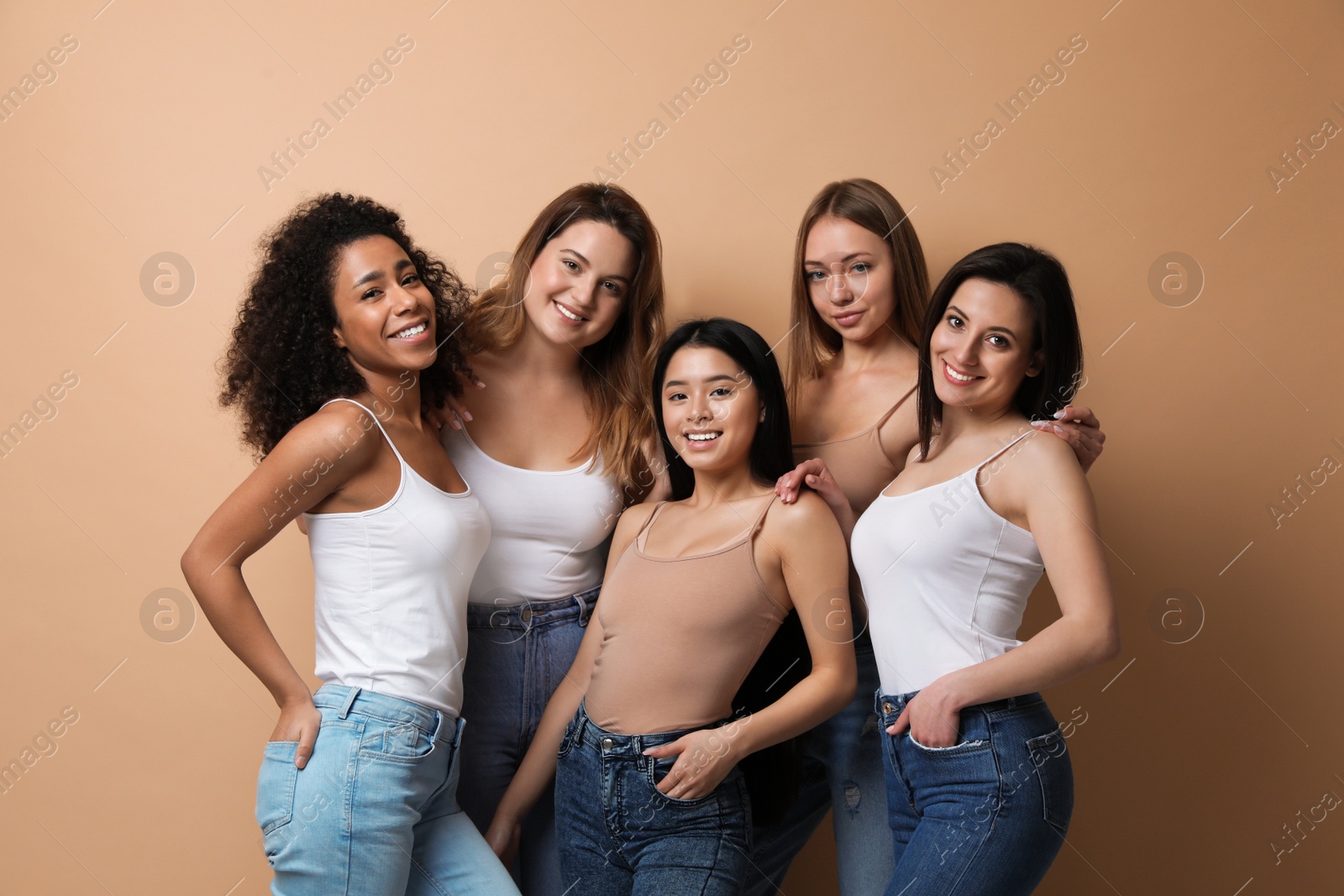 Photo of Group of women with different body types on beige background