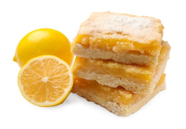 Photo of Tasty lemon bars with powdered sugar and fruits isolated on white