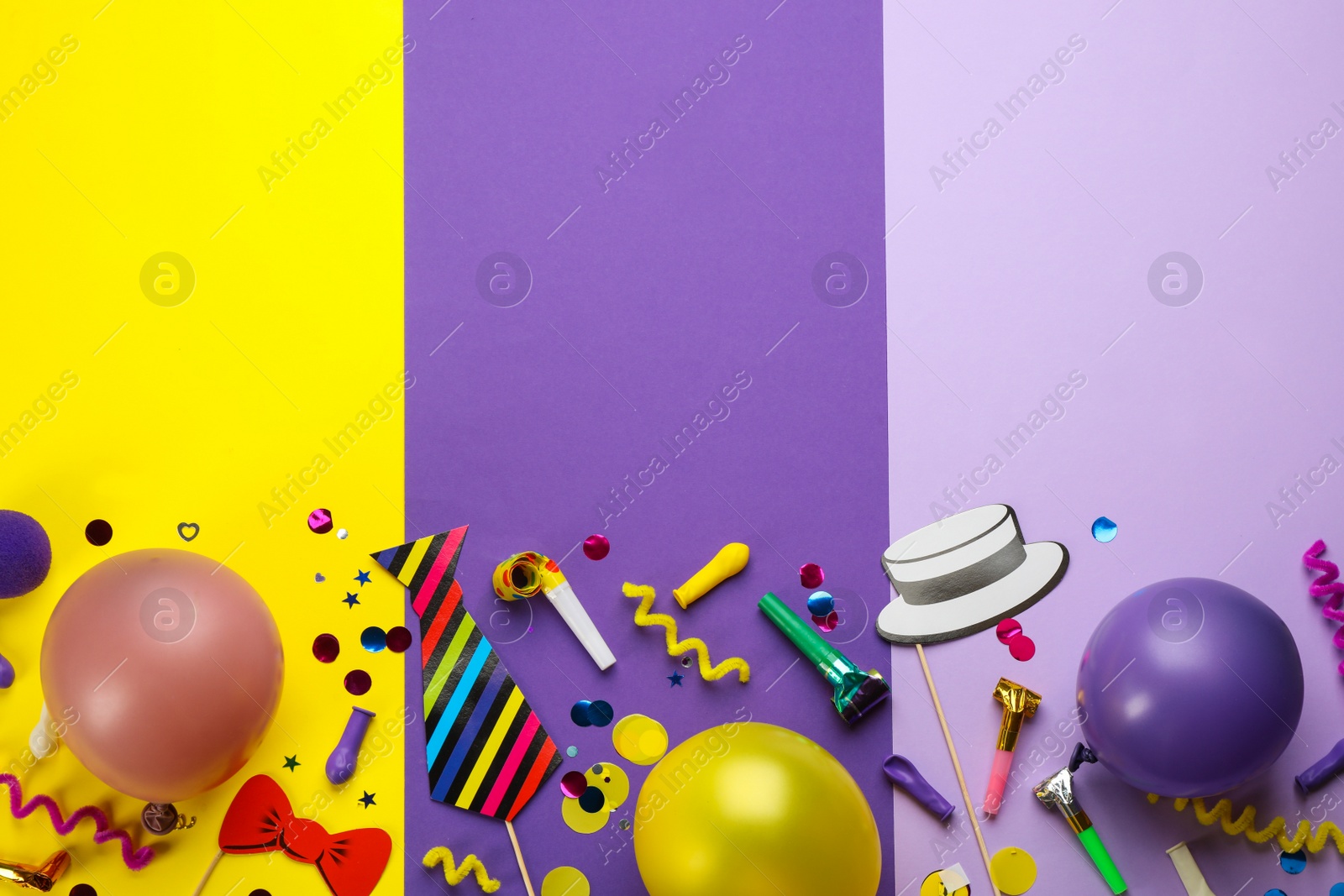 Photo of Flat lay composition with carnival items on color background. Space for text