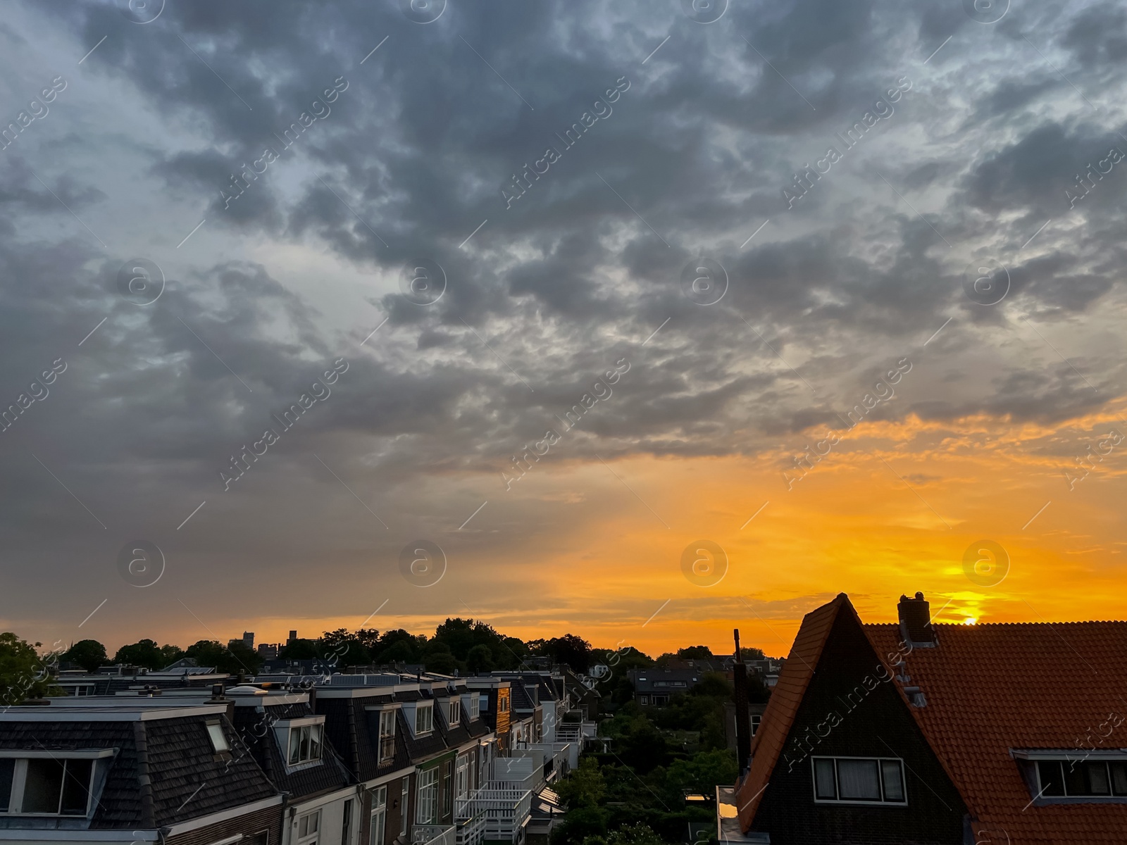 Photo of Picturesque view of city street with beautiful buildings at sunrise