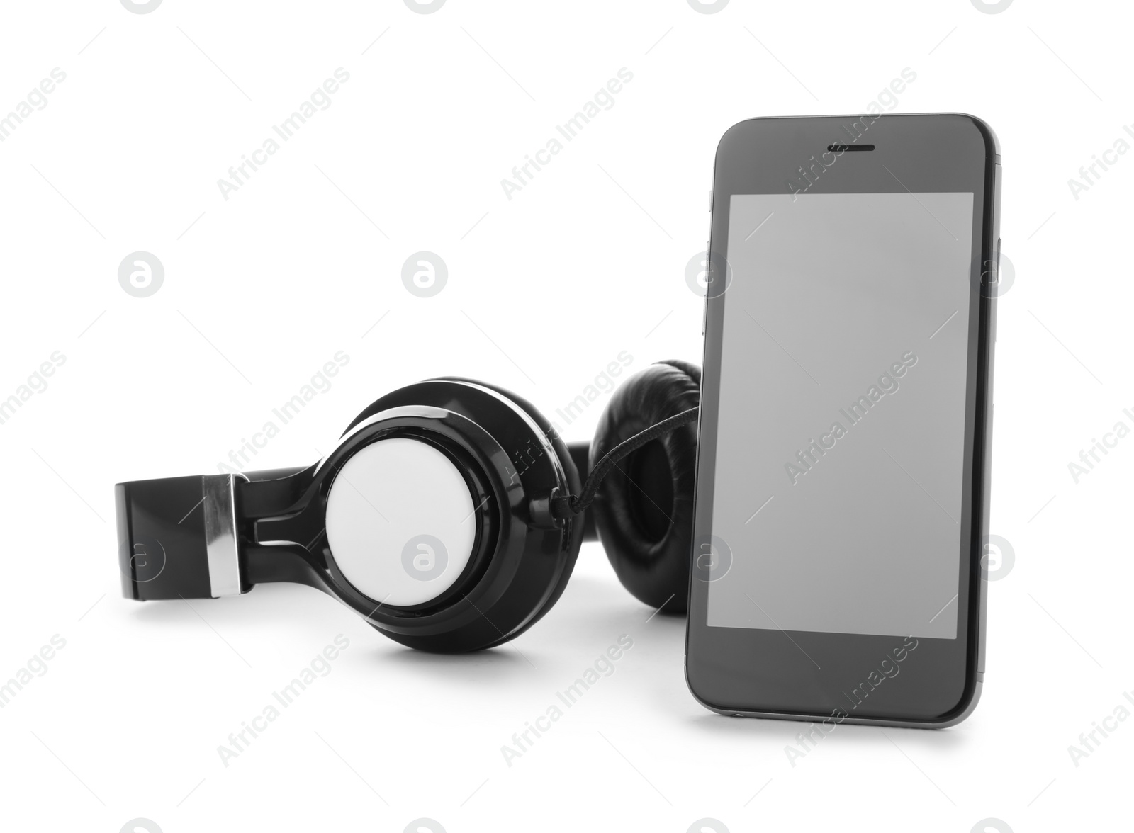 Photo of Smartphone with blank screen and headphones on white background