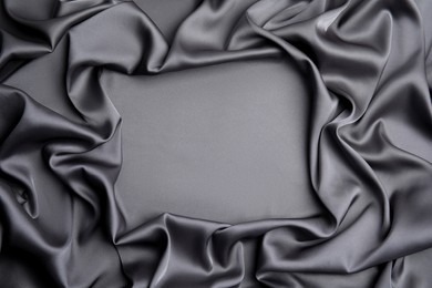 Photo of Texture of delicate black silk as background, top view