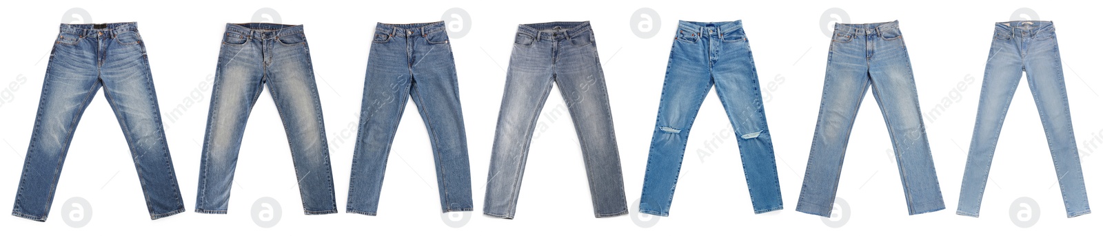 Image of Set with different jeans on white background, top view