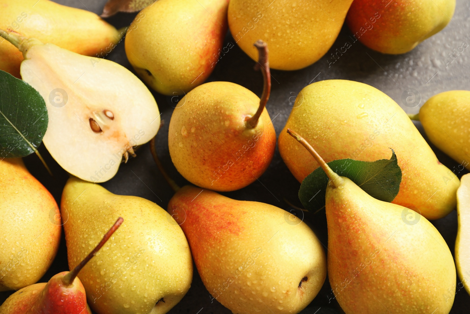 Photo of Many ripe pears on table, top view