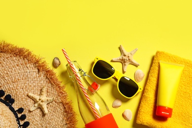 Photo of Flat lay composition with beach accessories on color background. Space for text