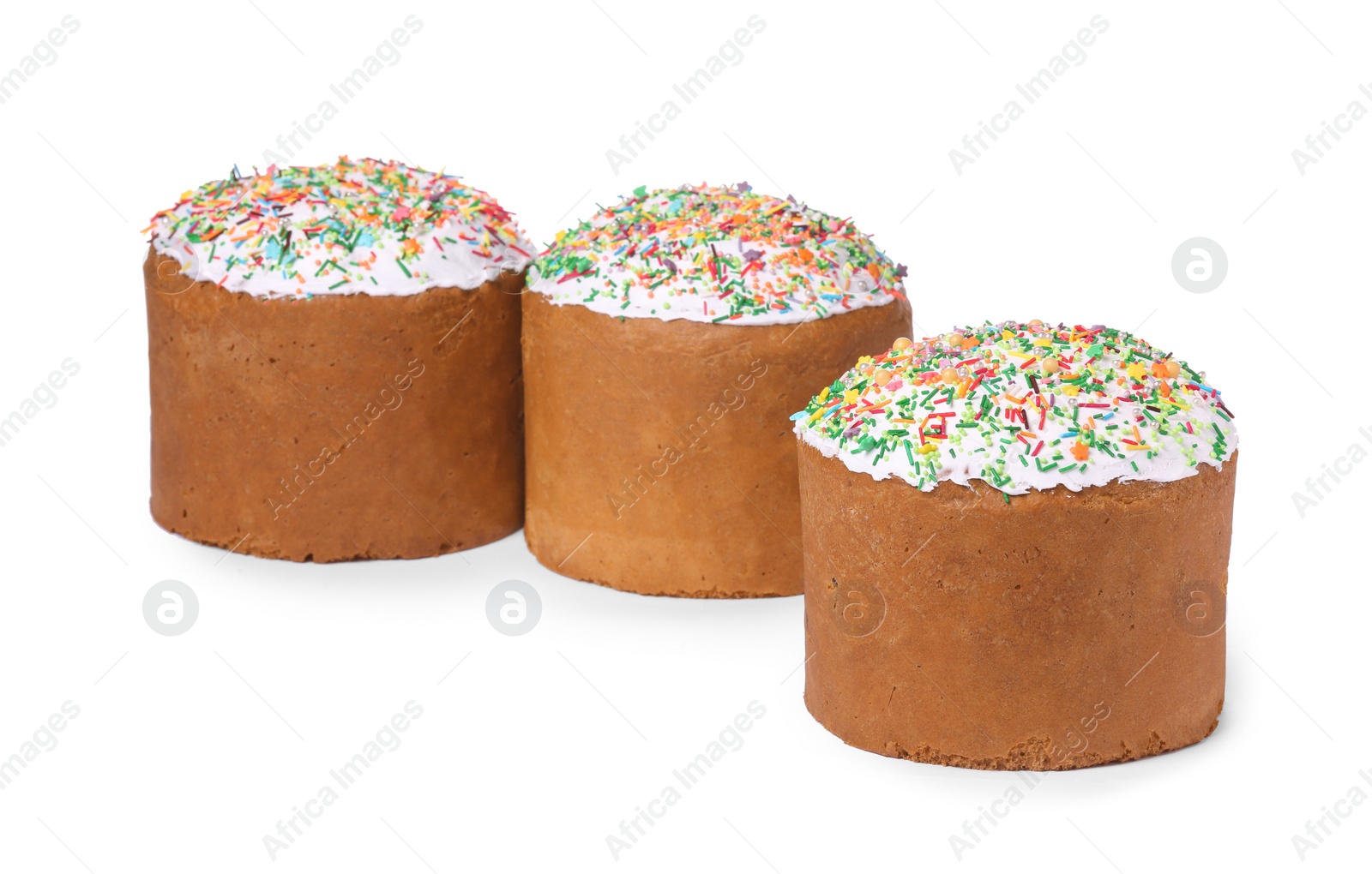 Photo of Traditional Easter cakes with sprinkles isolated on white