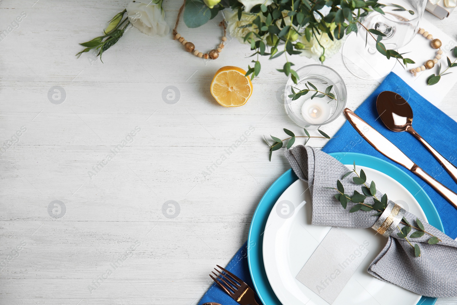 Photo of Elegant festive table setting on white wooden background, flat lay. Space for text