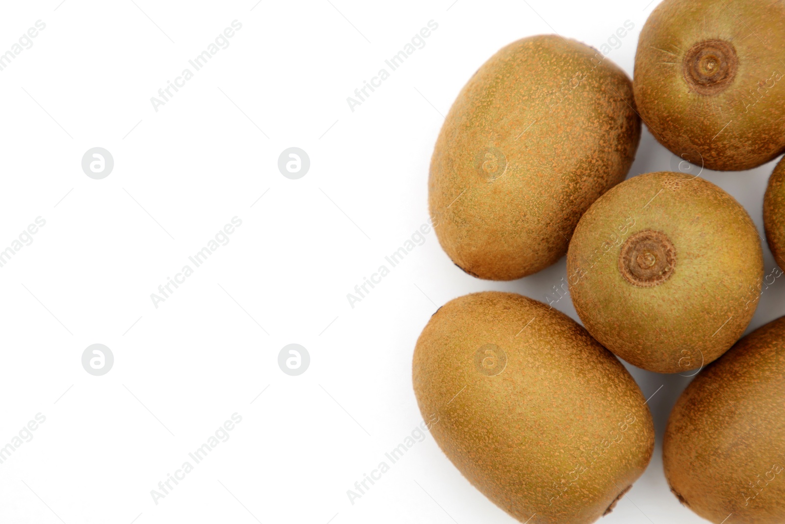 Photo of Whole fresh ripe kiwis on white background, top view