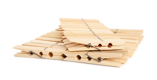 Set of wooden clothespins on white background