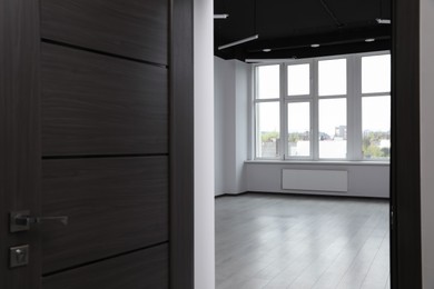 Modern empty office, view through open door