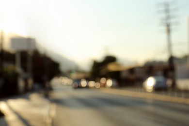 Blurred view of road with cars, bokeh effect