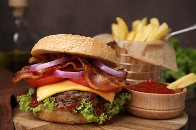 Photo of Tasty burger with bacon, vegetables and patty served with french fries and ketchup on table, closeup