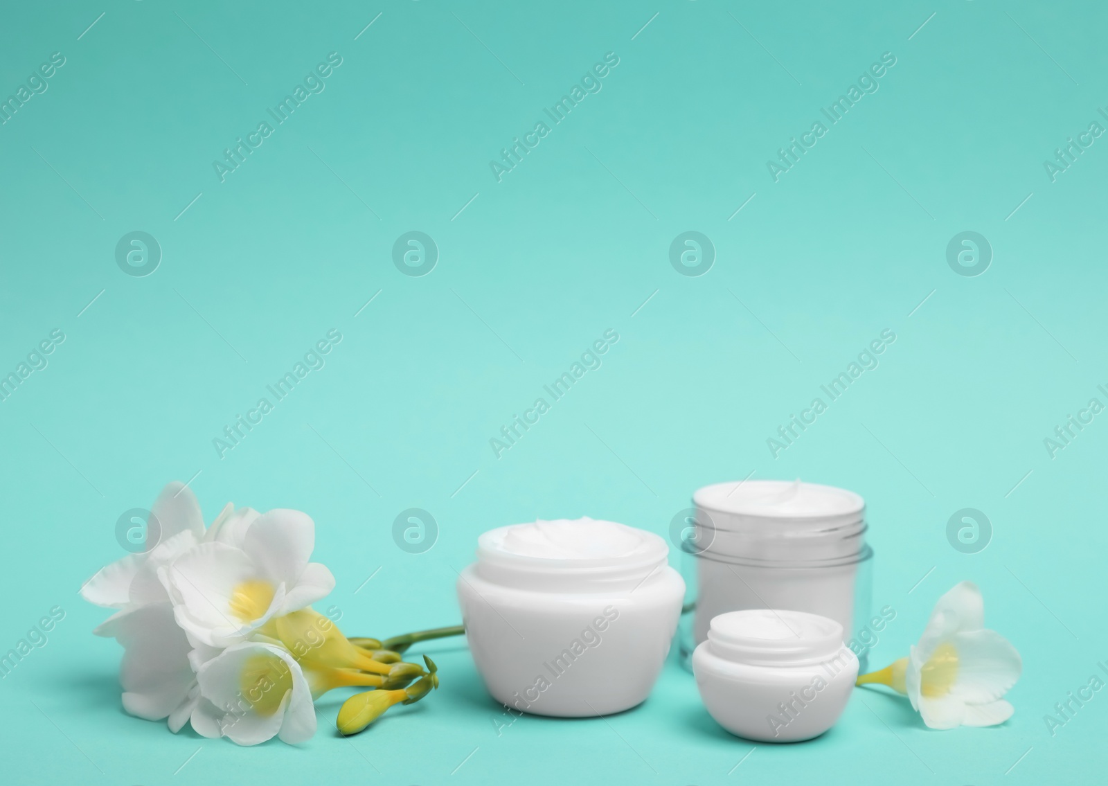 Photo of Composition with cosmetic products on color background