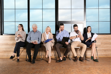 Photo of People waiting for job interview in office hall