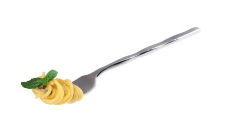 Fork with tasty pasta and basil isolated on white