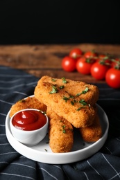 Photo of Plate of cheese sticks and sauce on table, closeup