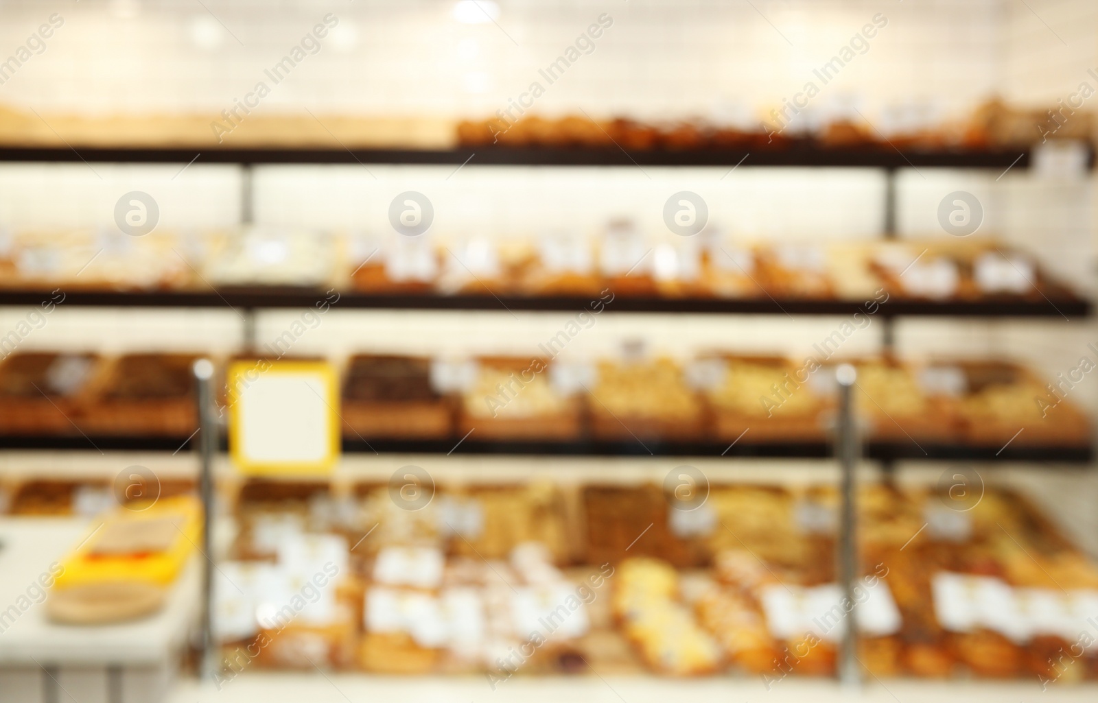 Photo of Blurred view of bakery store with pastries