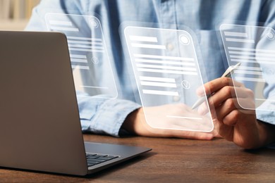 Image of Electronic signature. Man using virtual screen over laptop at wooden table, closeup