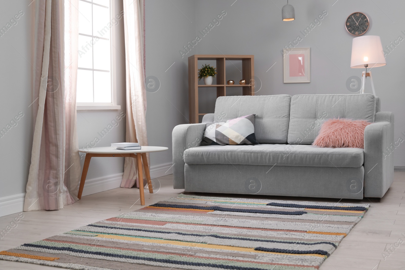 Photo of Modern living room interior with comfortable sofa and beautiful carpet