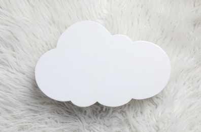 Photo of Cloud shaped child's night lamp on white faux fur, top view