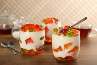 Delicious broken glass jelly dessert on wooden table