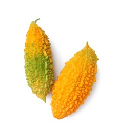 Photo of Fresh ripe bitter melons on white background, top view