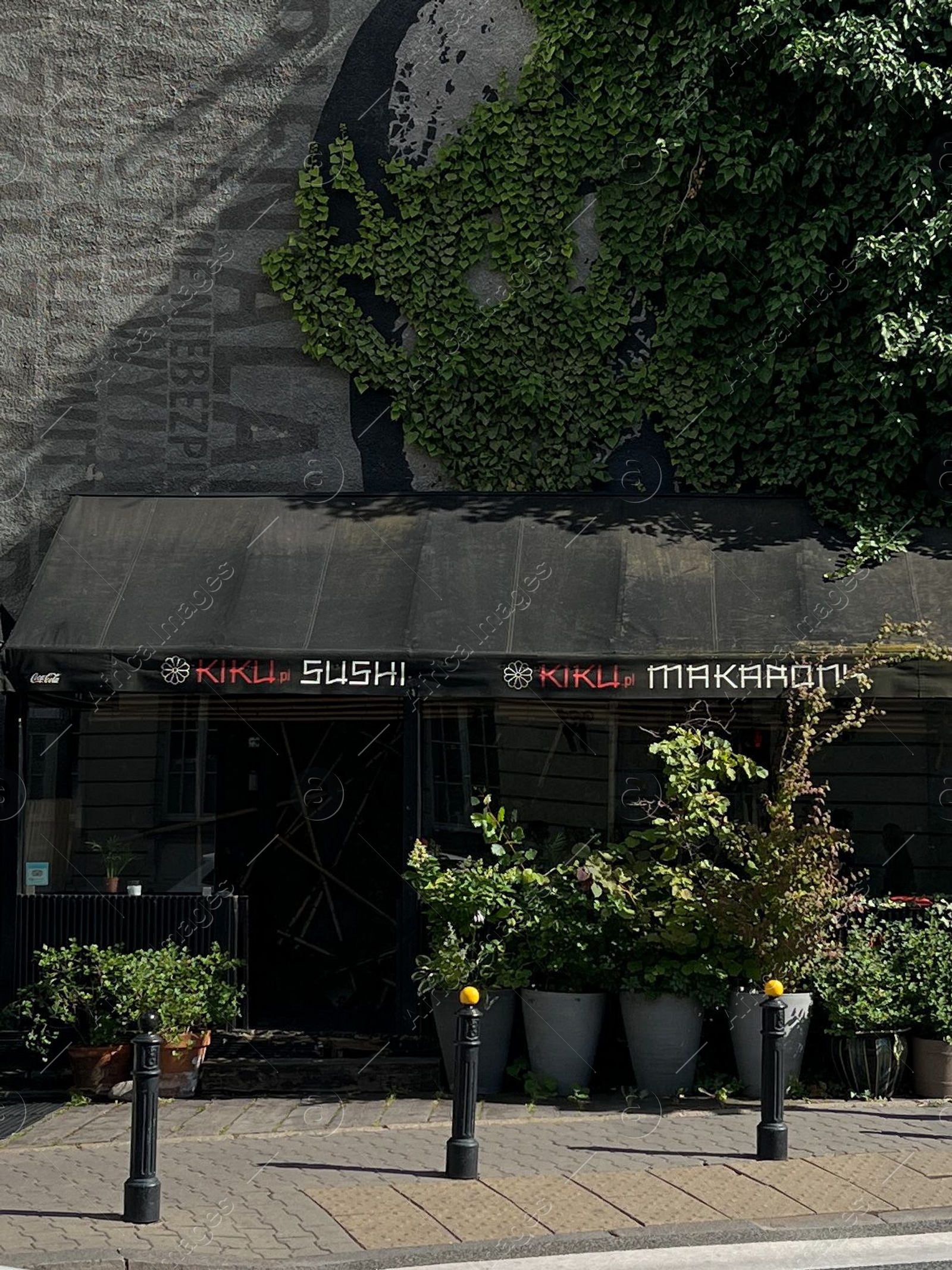 Photo of WARSAW, POLAND - JULY 17, 2022: Beautiful facade of modern sushi restaurant outdoors
