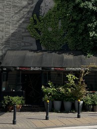 Photo of WARSAW, POLAND - JULY 17, 2022: Beautiful facade of modern sushi restaurant outdoors