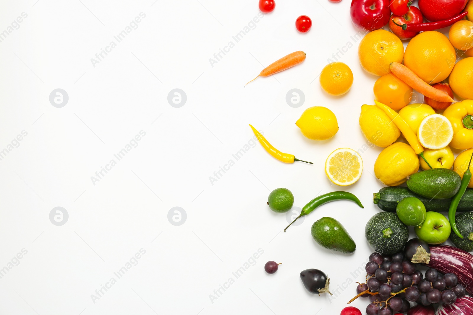 Photo of Rainbow composition with fresh vegetables and fruits on white background, flat lay