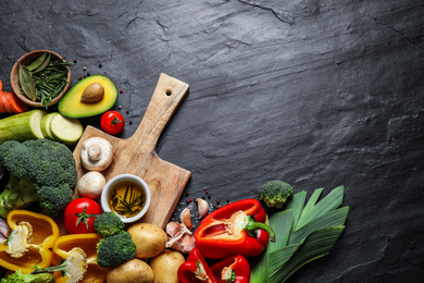 Photo of Flat lay composition with fresh products on grey table, space for text. Healthy cooking